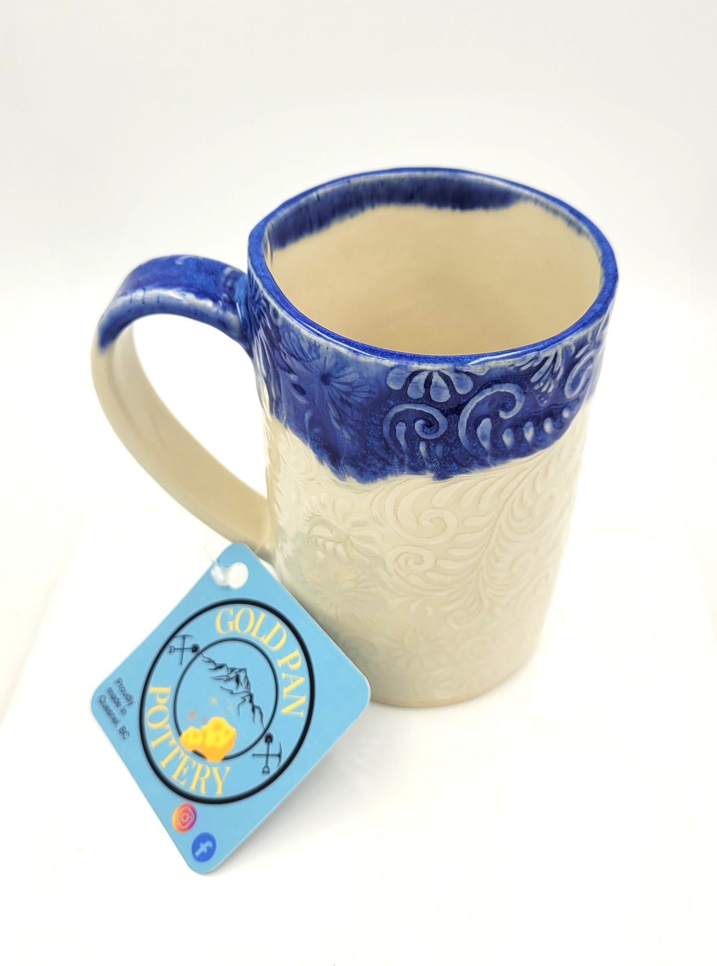 Natural white butterfly print handmade pottery mug with blue rim