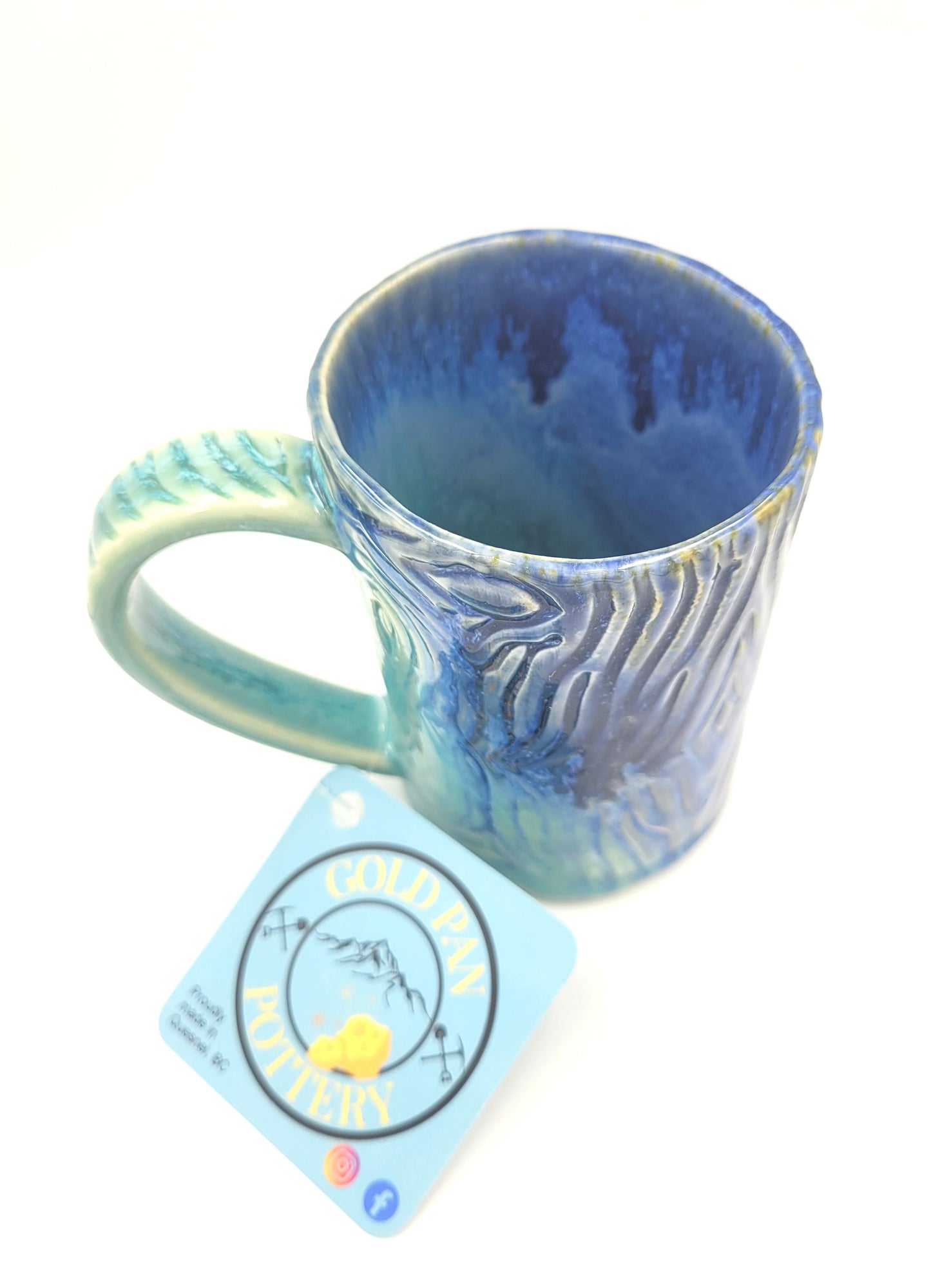 Handmade blue and teal pottery mug