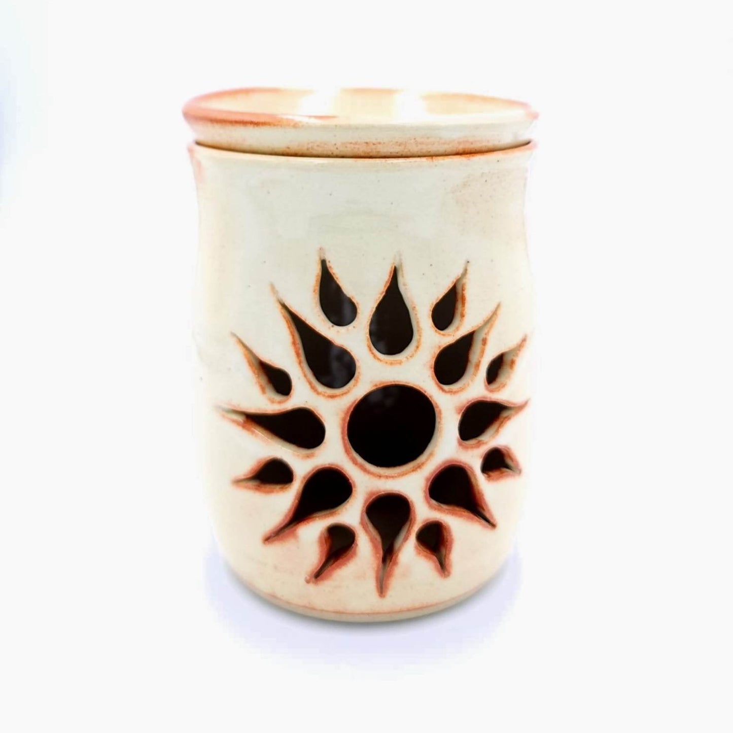 The wax melter features a beautiful hand-carved sunburst design that creates a warm and inviting atmosphere, while the rustic white glaze adds a touch of sophistication and elegance. Approximate dimensions:  12cm x 9cm  * two tea light candles are included. Scented wax or oils not included.